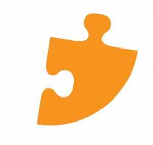 An orange jigsaw piece, part of the Canterbury BID logo