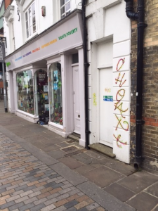 Graffiti beside a storefront