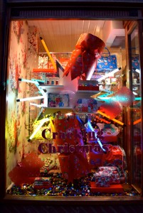 A large decorative cracker and letters that say Cracking Christmas in a Cath Kidston window
