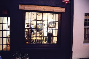 A festively decorated The Living Lounge window
