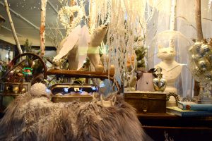 A festively decorated Queen Bee Home window