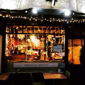 A festively decorated Refectory Kitchen window