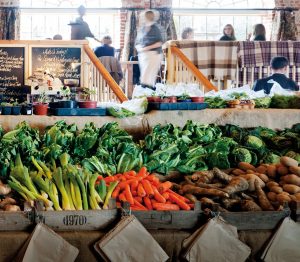 A photo of some vegetables at a market stall