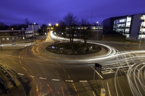 A photo of a roundabout at night