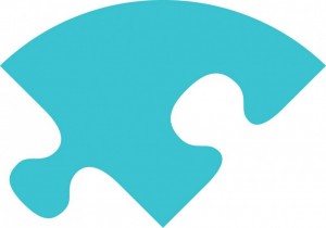 A blue jigsaw piece, part of the Canterbury BID logo