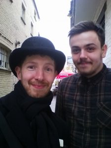 two men smiling together in a selfie