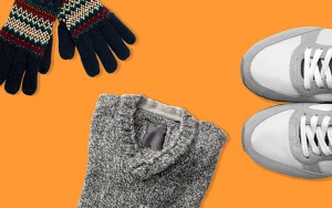 Some gloves, a grey jumper and a pair of trainers on an orange background