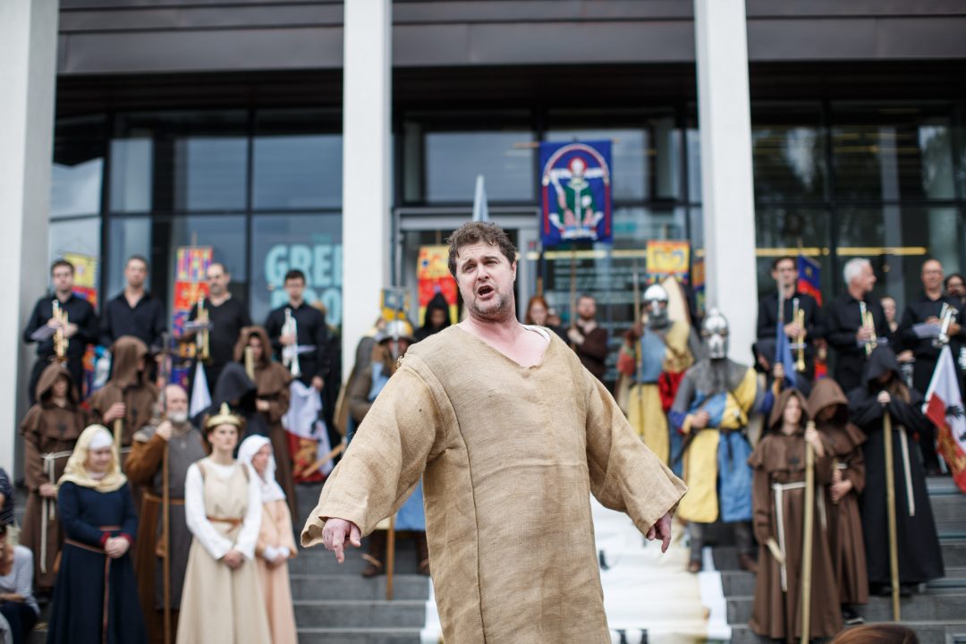 A medieval pageant actor performing