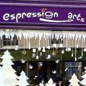 A festively decorated Expression Arts window