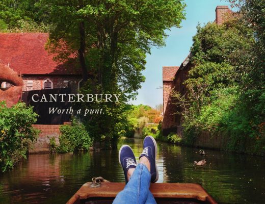A photo of a persons legs cruising in a river boat with text over it that reads Canterbury - Worth a punt