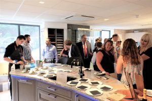 A room of people socialising and networking at a Designed Interiors event