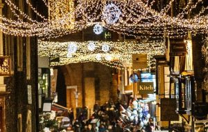 Hanging christmas lights in Canterbury highstreet