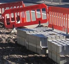 Some cement blocks and road blockers where roadworks are being done