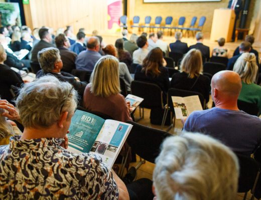 An audience of people awaiting a Canterbury BID conference