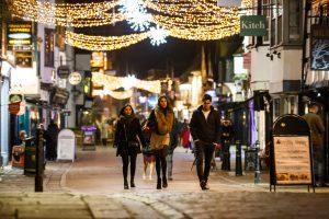 A photo of Canterbury high street, lit by christmas lights at night