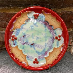 A photo of a christmas themed ceramic plate