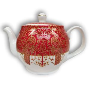 A photo of a white, red and gold teapot