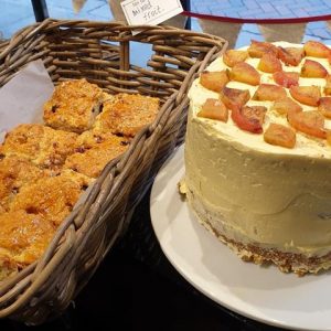 A photo of some baked goods and a cake from Tiny Tim's Tearoom