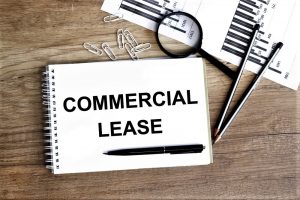 A photo of a notepad on a table with writing on it that says commercial lease