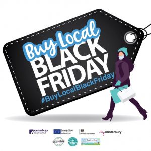 A sign resembling a tag which reads buy local black friday #buylocalblackfriday