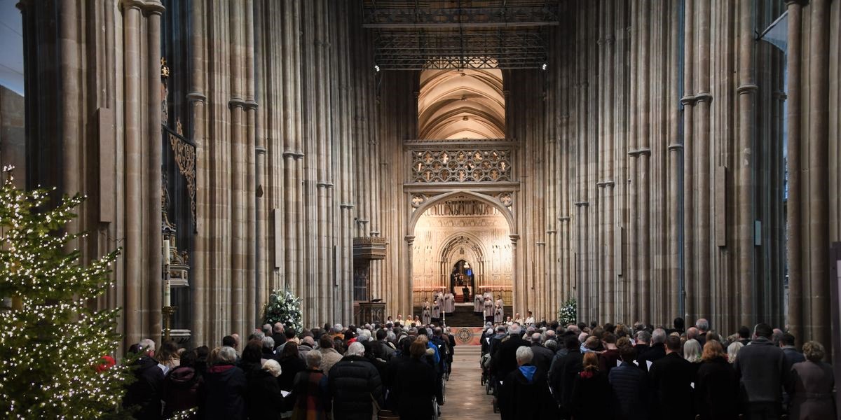 A photo of a carol service taking place inside of Canterbury Cathedral