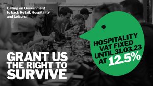 A banner that reads calling on government to back retail, hospitality and leisure - grant us the right to survive - hospitality VAT fixed until 31.03.23 at 12.5%