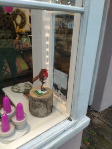A photo of a Lego robin in a shop window