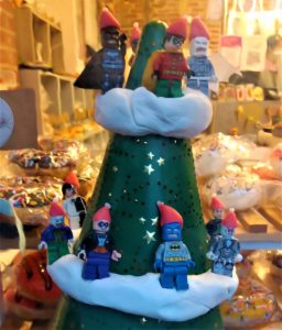 A photo of LEGO figures decorating a shop window Christmas tree