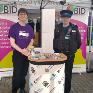 A photo of a Canterbury Bid Purple Flag volunteer and a policeman standing together