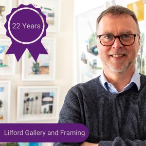 A photo of a man smiling with text that reads 'Lilford Gallery and Framing - 22 years'