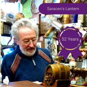 A photo of a man with text that reads 'Saracen's Lantern - 52 years' over it