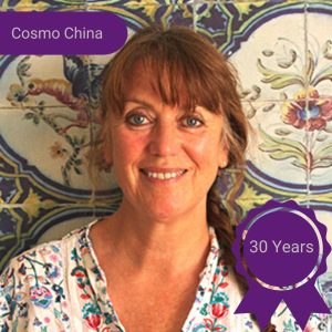 A photo of a smiling woman with text that reads 'Cosmo China - 30 years'