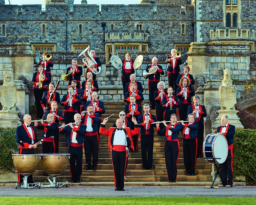 A photo of a band performing on some cathedral steps for the Queen's Jubilee